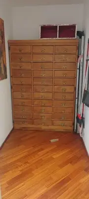 a large wooden chest of drawers in a room at Casa Argia in Rome