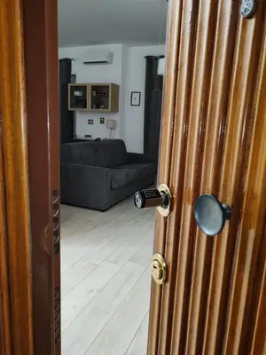a door that is open to a living room at Holiday Home in Rome