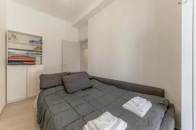 a bedroom with a bed with two towels on it at Holiday Home in Rome