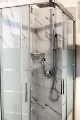 a shower with a glass door in a bathroom at Relais Circo Massimo in Rome