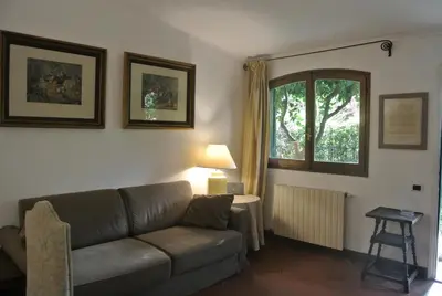 a living room with a couch and a window at Appartamento Garden Palatino in Rome