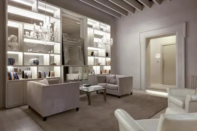 a living room with two chairs and a table at Terrace Pantheon Relais in Rome
