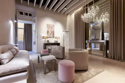a living room with a couch and chairs and a table at Terrace Pantheon Relais in Rome