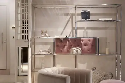 a glass shelf with shoes and a chair in a room at Terrace Pantheon Relais in Rome