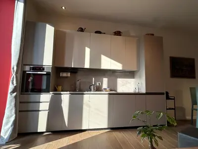 a kitchen with white cabinets and a stove at CBMC - Couldn't Be More Central in Rome