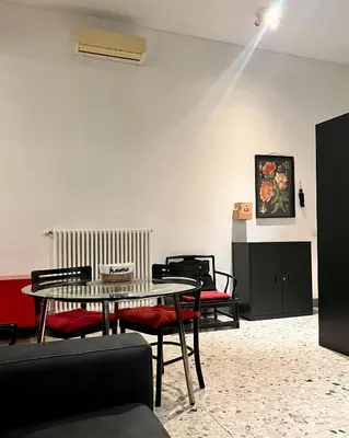a dining room with a table and chairs at Spacious Studio in Via dei Coronari in Rome