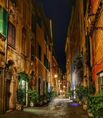 an empty street in an old town at night at Spacious Studio in Via dei Coronari in Rome
