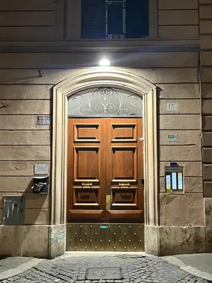a wooden door on the side of a building at Flat 7 Rome Guesthouse in Rome