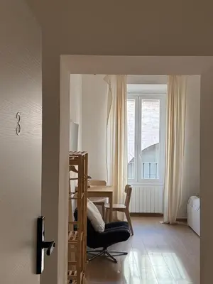 a room with a desk and a chair and a window at Flat 7 Rome Guesthouse in Rome