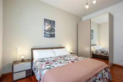 a bedroom with a bed and a mirror at Carpegna Park Apartment by Cornelia subway in Rome