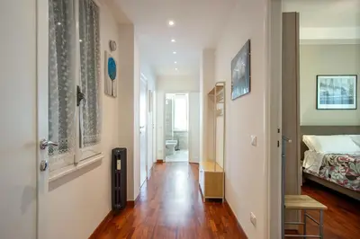 a hallway with a room with a bed and a hallway sidx sidx sidx at Carpegna Park Apartment by Cornelia subway in Rome