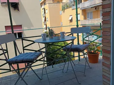 a table and two chairs sitting on a balcony at Casa Erminia in Rome