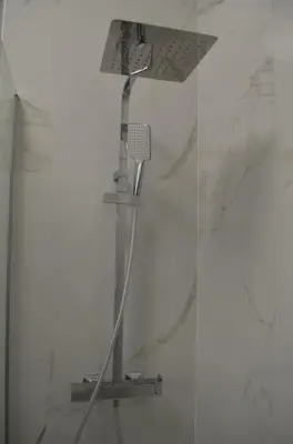 a shower with a shower head in a bathroom at Casa Erminia in Rome