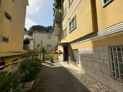 an alleyway between two buildings in a city at Vintage Charm Apt in Aurelio in Rome
