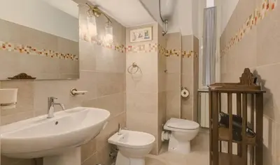 a bathroom with a sink and a toilet at Domus Ottavia in Roma in Rome