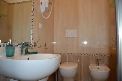a bathroom with a sink and a toilet at Ad Maiora bb Roma Musei Vaticani in Rome