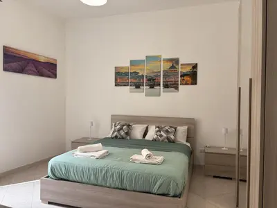 a bathroom with a washing machine and a washer at RHome Apartment in Rome