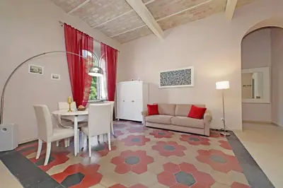 a living room with a table and a couch at dolce casa colosseo 2 in Rome