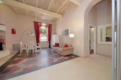 a living room with a couch and a table at dolce casa colosseo 2 in Rome