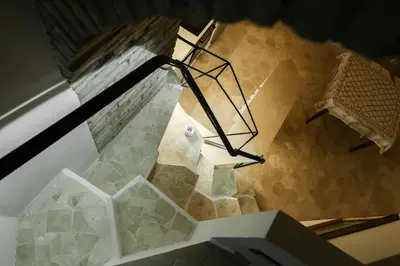 an overhead view of a staircase with a table and chair at Casa Cavour in Rome
