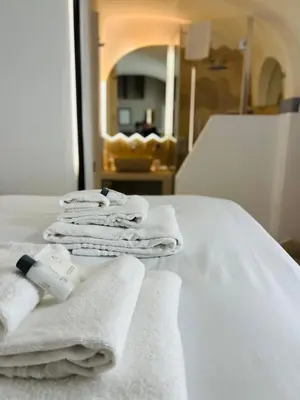 a hotel room with white towels on a bed at Casa Cavour in Rome