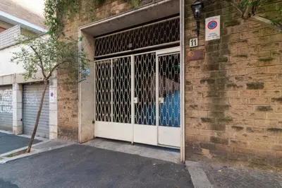 an open door of a brick building at Ponte Milvio Holiday Home in Rome