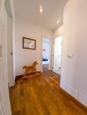 a room with a horse toy on a wooden floor at Stunning 3-Bedroom Penthouse in Rome