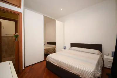 a small bedroom with a bed and a mirror at Yellowmat by Ghor in Rome