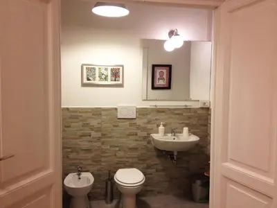 a bathroom with a toilet and a sink at Domò Vaticano Guest House in Rome