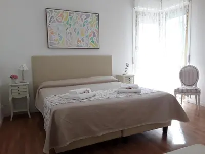 a bedroom with a bed with two towels on it at L'Incantevole Aventino in Rome