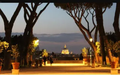 a view of the capitol building at night with trees at L'Incantevole Aventino in Rome