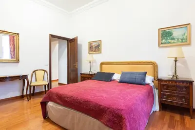 a living room with a couch and a chair at Elegant Salandra Suite in Rome