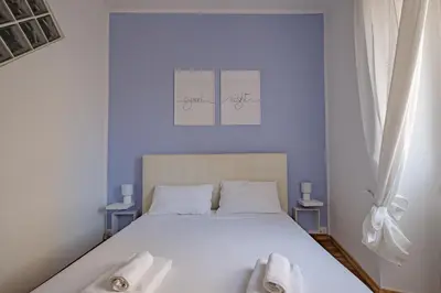 a bedroom with a bed with two towels on it at Apartment B5 in the center of Rome WiFi and AC in Rome