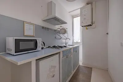 a kitchen with a microwave and a stove top oven at Apartment B5 in the center of Rome WiFi and AC in Rome