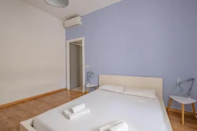 a bedroom with a white bed with two towels on it at Apartment B5 in the center of Rome WiFi and AC in Rome