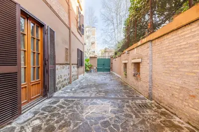 an empty alley way between two buildings at Residenza Latina -Charme & Relax in Rome