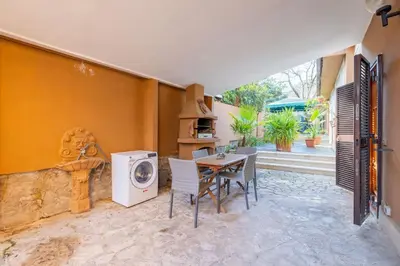 a dining room with a table and a washing machine at Residenza Latina -Charme & Relax in Rome