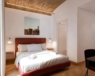 a bathroom with a shower with a toilet and a sink at Urban Vatican Rooms in Rome