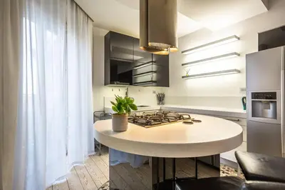 a kitchen with a island in the middle of a room at Charme & Luxe 2 bedroom apartment City Center in Rome