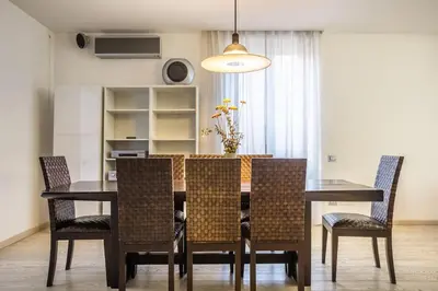 a dining room with a table and chairs at Charme & Luxe 2 bedroom apartment City Center in Rome