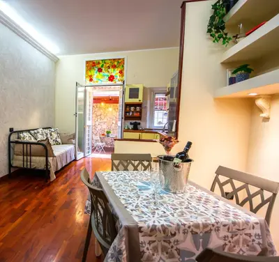 a living room with a table and a couch at Vicolo 35 in Rome