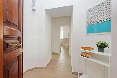 a hallway with a door leading to a bathroom at Doria in Rome