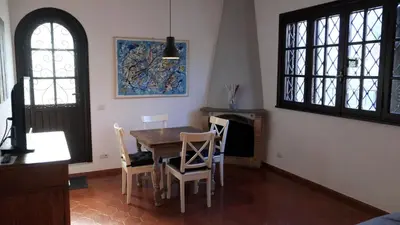 a dining room with a table and chairs at Borgo Pio Holiday in Rome