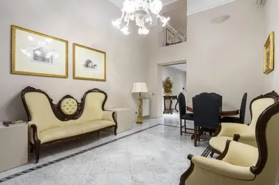 a waiting room with chairs and a table at Navona New Deluxe Apartment in Rome