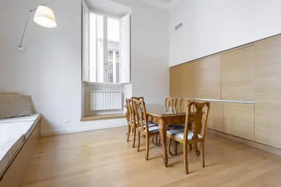 a dining room with a table and chairs at Navona New Exclusive Apartment in Rome