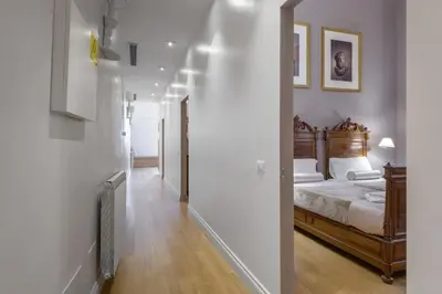 a bedroom with a bed and a mirror at Navona New Exclusive Apartment in Rome