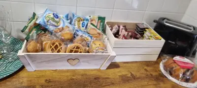two boxes of food sitting on a table at Barbara Sweet Home - Appartamento Intero in Rome