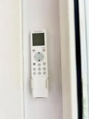 a remote control is attached to a wall at Room Ostiense in Rome