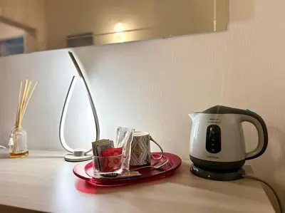 a coffee maker sitting on top of a table at Room Ostiense in Rome