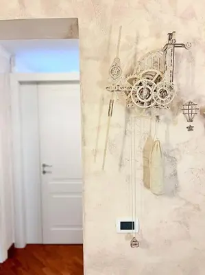 a room with a white door and a wall with a clock at Room Ostiense in Rome